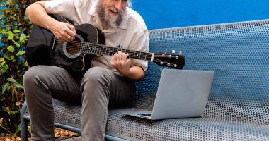 mature-caucasian-man-sitting-on-bench-learning-to-2022-07-12-17-14-45-utc.jpg